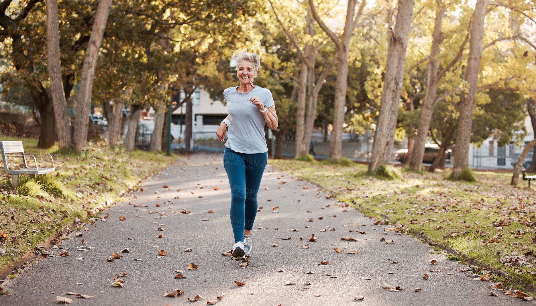 Buy stock photo Exercise, senior and woman running in park for fitness, health and wellness mock up. Sports, retirement and happy elderly female from Canada jog, exercising or training outdoors alone for marathon.