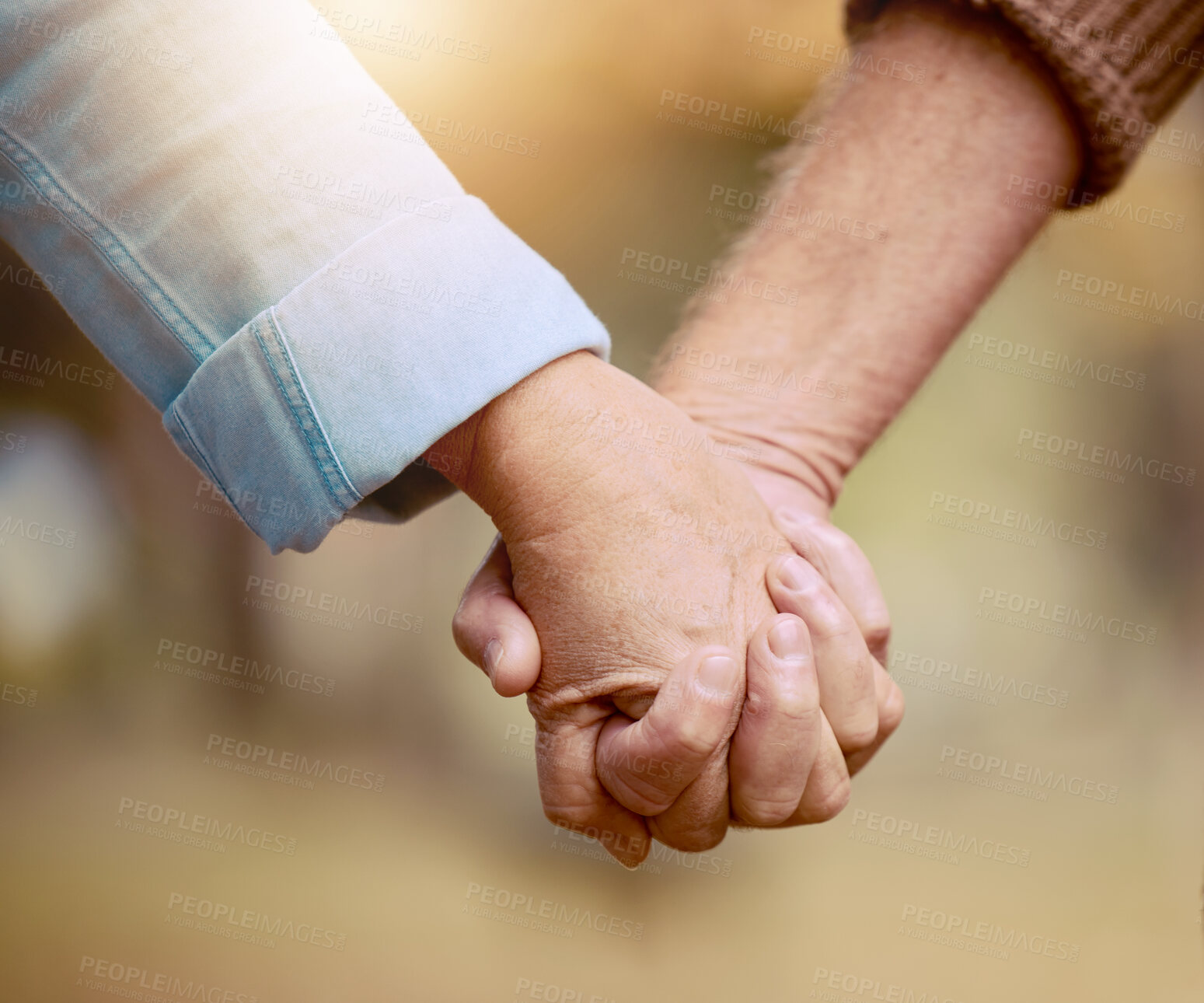 Buy stock photo Senior couple, holding hands and walking in nature to bond in the countryside for love, care and affection. Retirement, hands of elderly husband and wife together in a loving, caring relationship