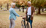 Bike, senior couple and travel outdoor for wellness, bonding and conversation. Love, retirement and mature man with elderly woman, cycling and loving together for hobby, talking and riding for health