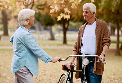 Buy stock photo Love, bike and park with a senior couple on a date together during summer while enjoying retirement. Nature, dating and romance with a mature man and woman outdoor in a garden for bicycle bonding
