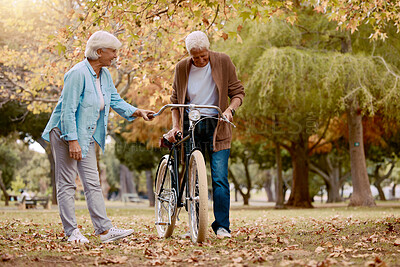 Buy stock photo Senior couple, walking and bike in nature park together for romace date, quality time and relax freedom outdoor. Love, support care and summer walk for retirement, happy man and woman with bicycle 