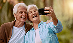 Senior couple and phone selfie and smile together outdoor during summer, social media and happy in park. Happy, Elderly man and woman take pictures on mobile smartphone for internet post or happiness