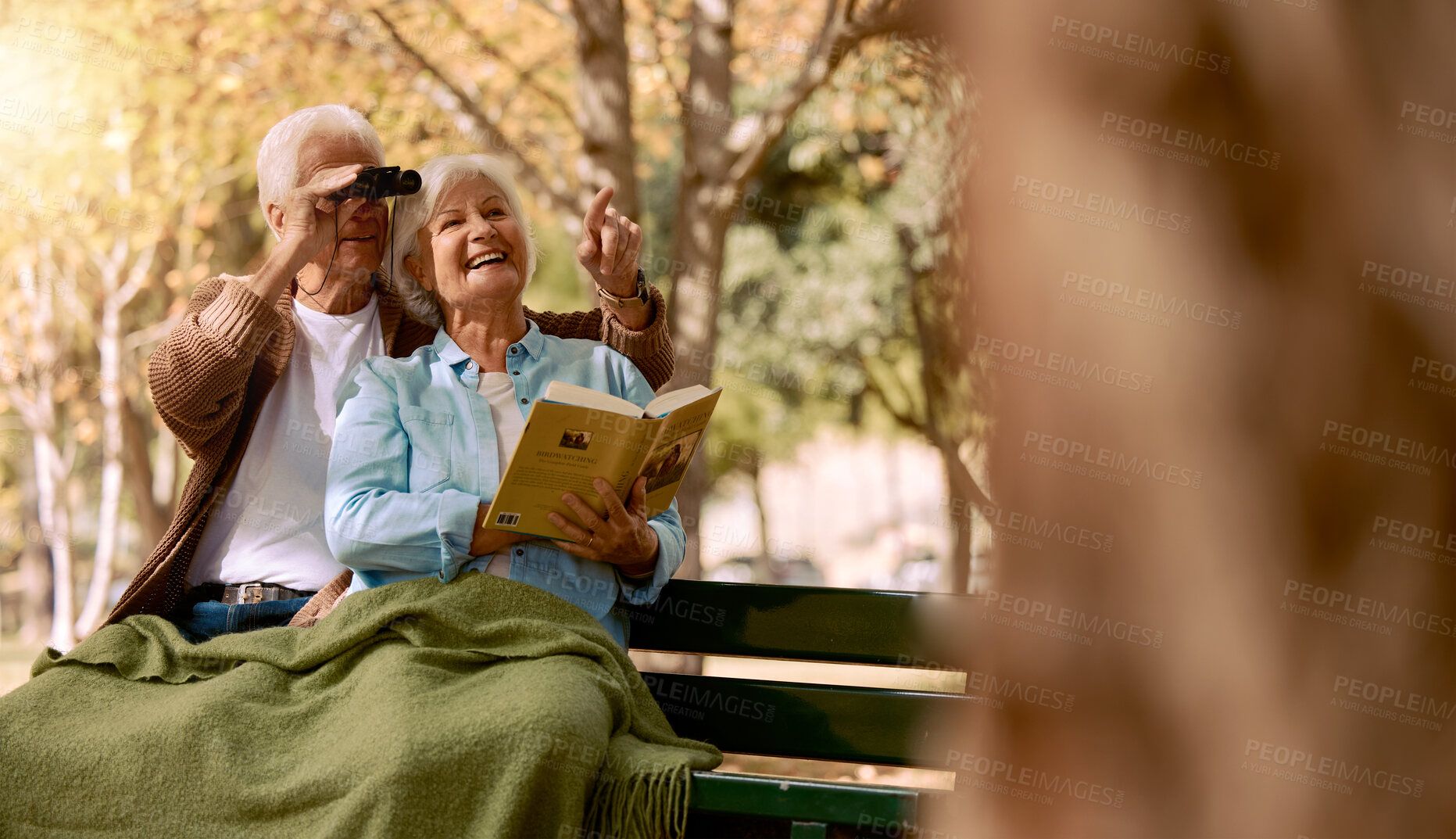 Buy stock photo Bird watching, book and senior couple in a park, retirement hobby and holiday adventure in Sweden. Bird search, elderly smile and man and woman with knowledge of animals and binoculars in nature