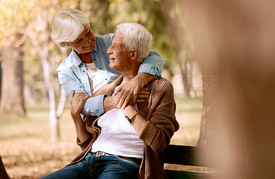 Buy stock photo Love, senior couple and hug in park on bench, bonding and romantic together outdoor. Romance, mature man and elderly woman embrace, loving or happy for relationship, marriage and retirement in nature