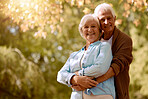 Nature, hug and mockup with a senior couple embracing outdoor in a park together during retirement. Portrait, romance and love with a mature man and woman hugging in a garden with plants or trees