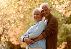 Love, romance and old couple hug in garden, happy in retirement. Nature, summer and senior man and woman hugging. Marriage, loyalty and a smile, outdoor time for elderly people to relax on weekend.