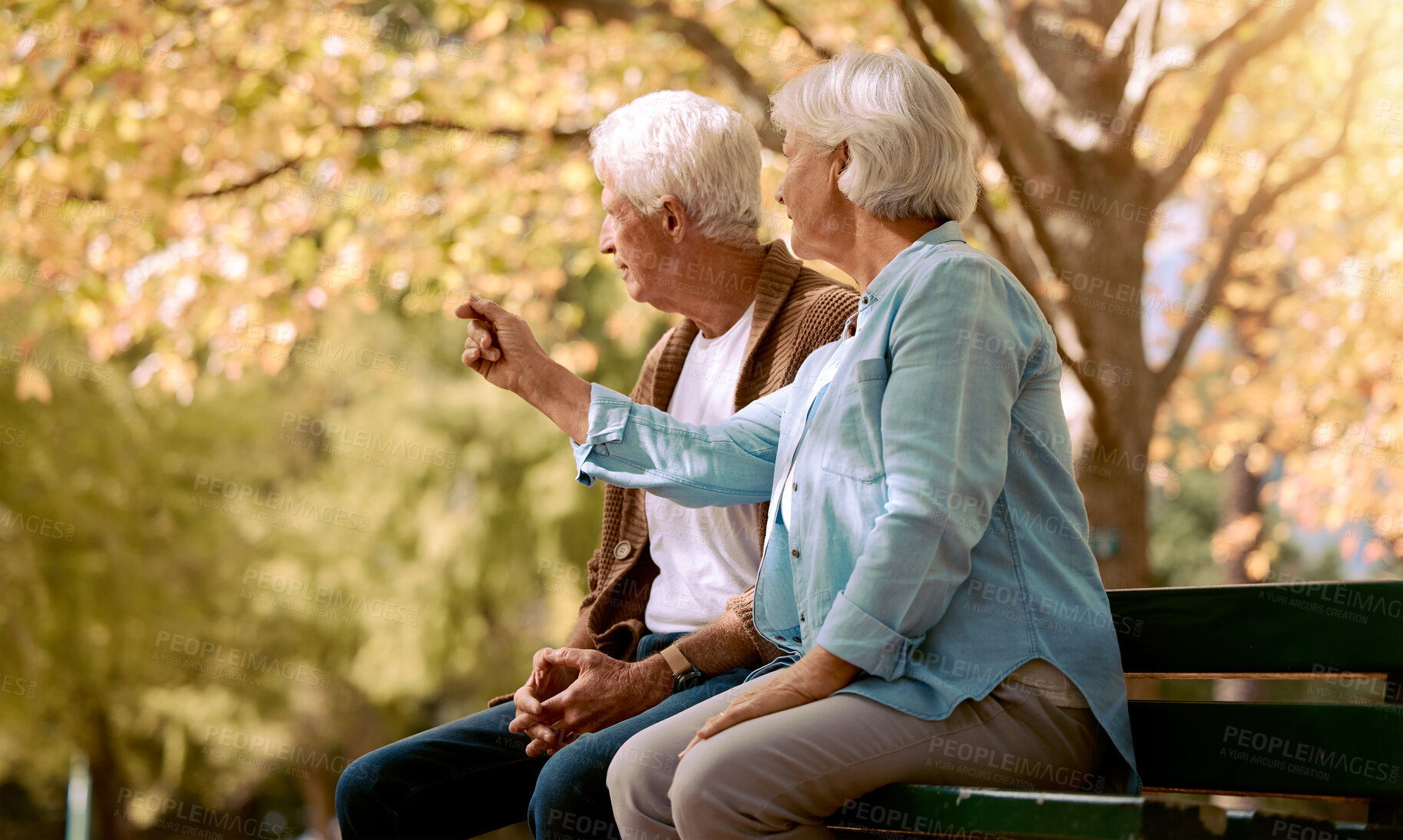 Buy stock photo Park love, communication and senior couple in nature to relax, retirement peace and outdoor conversation. Summer care, content and talking elderly man and woman on a bench in Portugal in spring