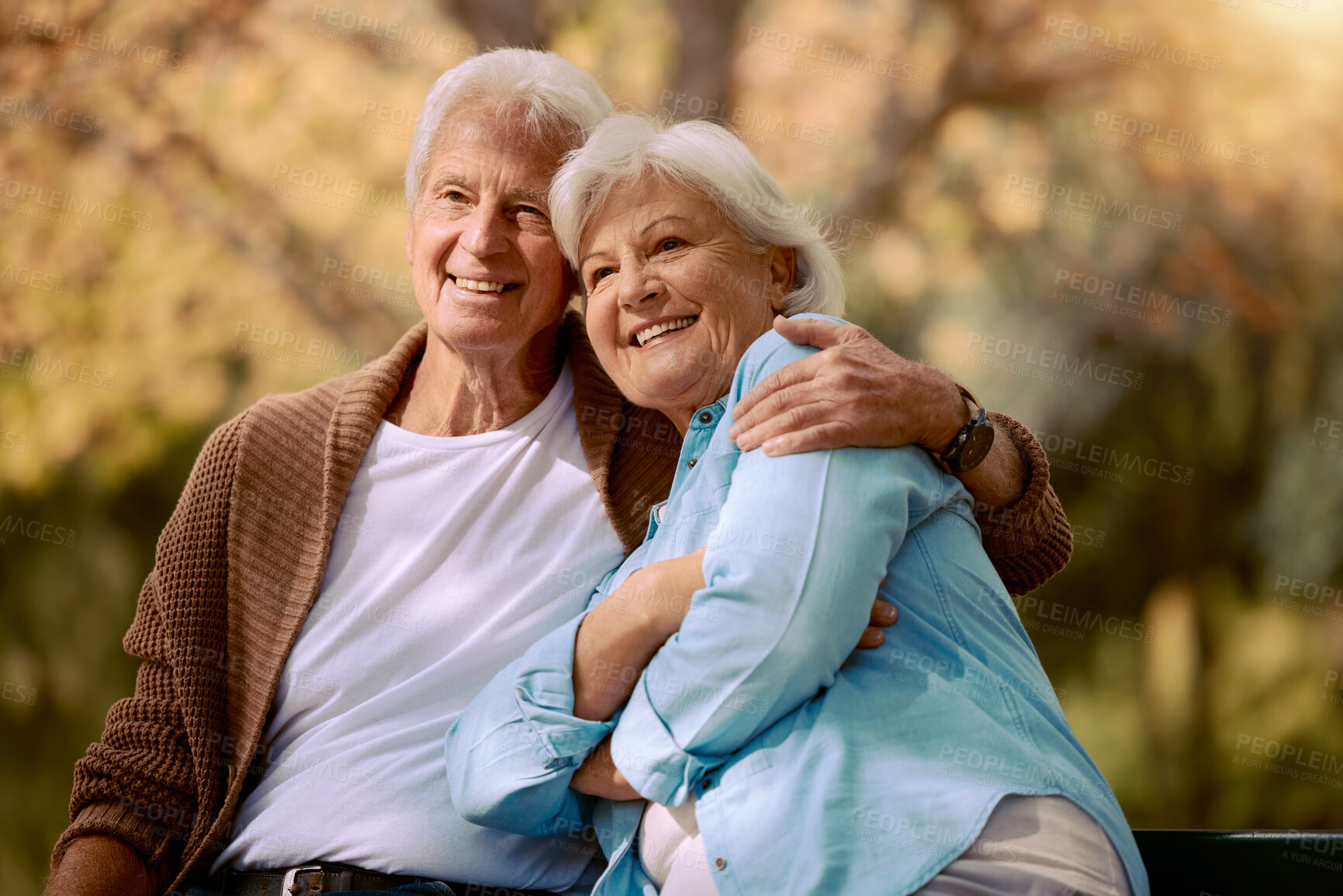 Buy stock photo Elderly, couple hug in the park with love and happy in retirement, outdoor in nature, calm and peace with view. Senior man with woman, smile and support, embrace and bonding in Boston public garden.