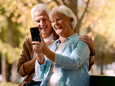 Buy stock photo Senior couple, phone selfie and happy smile, love and relax in outdoor park, summer and social media picture on bench. Elderly man, woman or mobile smartphone, photo and happiness together in nature 