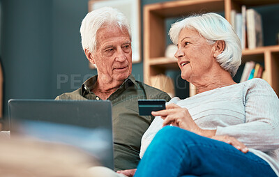 Buy stock photo Senior couple, laptop and credit card for online shopping, ecommerce and paying bills online while talking about savings, investment and retirement. Old man and woman together for banking payment