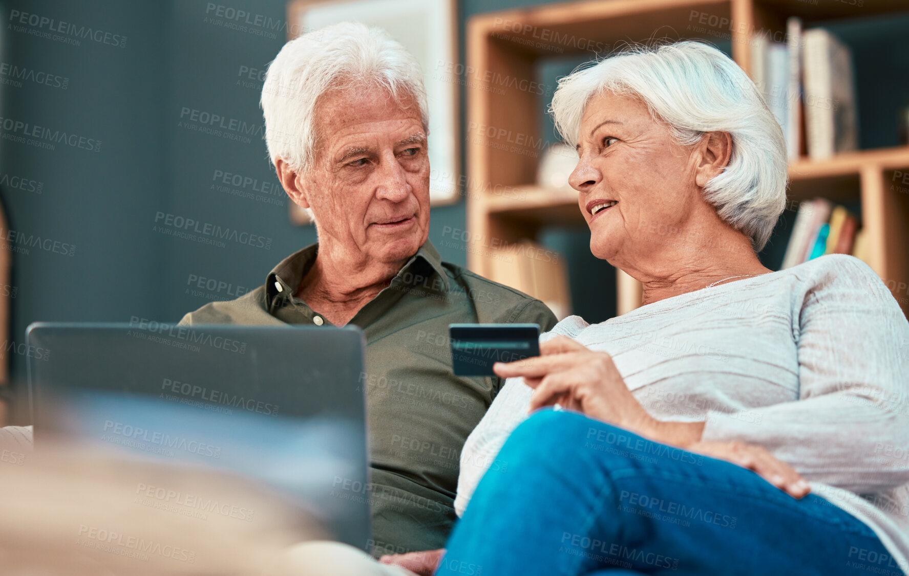 Buy stock photo Senior couple, laptop and credit card for online shopping, ecommerce and paying bills online while talking about savings, investment and retirement. Old man and woman together for banking payment