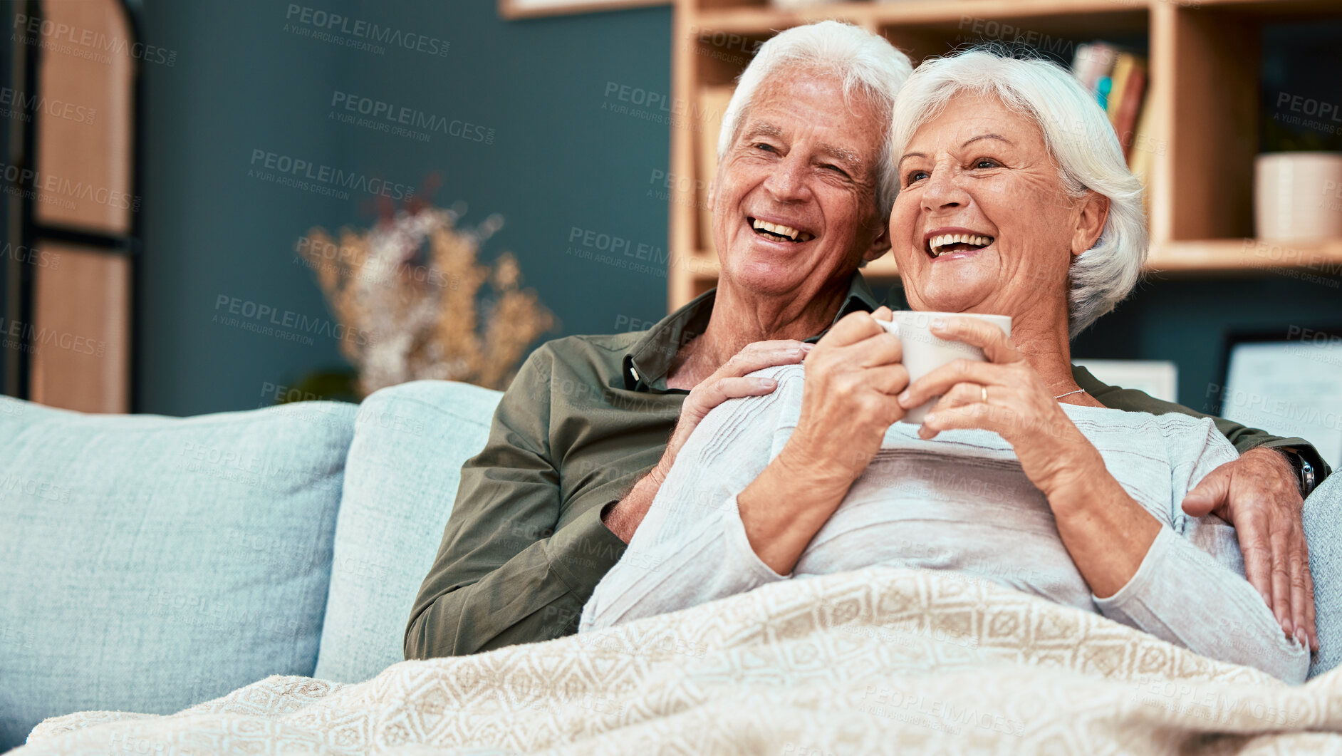 Buy stock photo Love, senior couple relax on sofa drinking coffee and watching comedy movie on television. Retirement, old man and woman on couch in living room watching tv and smile in affection in home together.