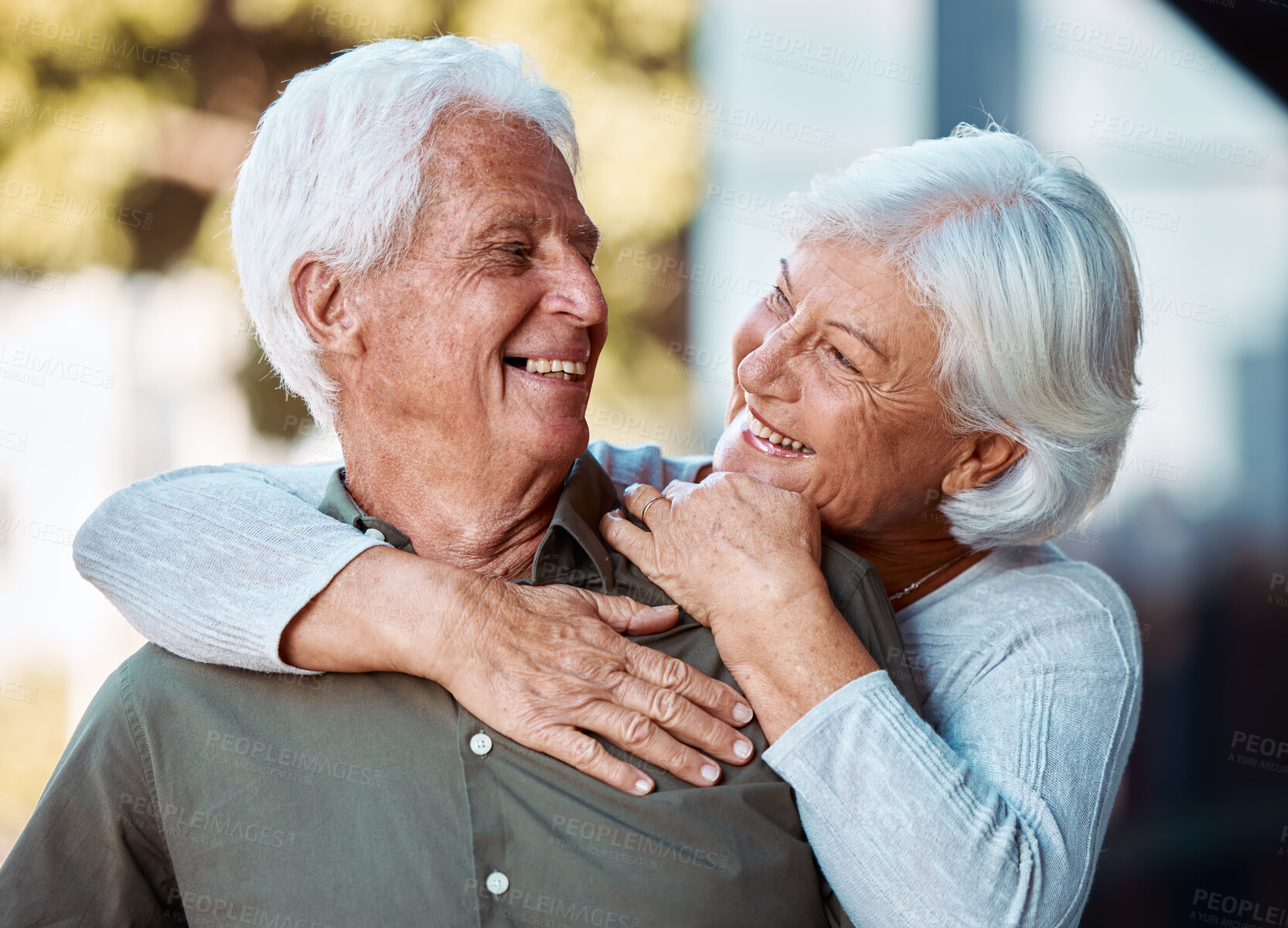 Buy stock photo Love, senior couple and hug for happiness, retirement and bonding together outdoor. Romantic, old man and elderly woman embrace, smile and loving for relationship, anniversary and wellness to relax.