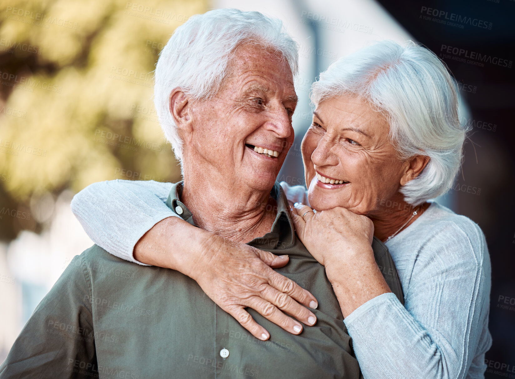 Buy stock photo Love, romance and dating with a senior couple hugging outdoor in nature together during retirement. Relax, park and countryside with a mature man and woman bonding in a garden during summer