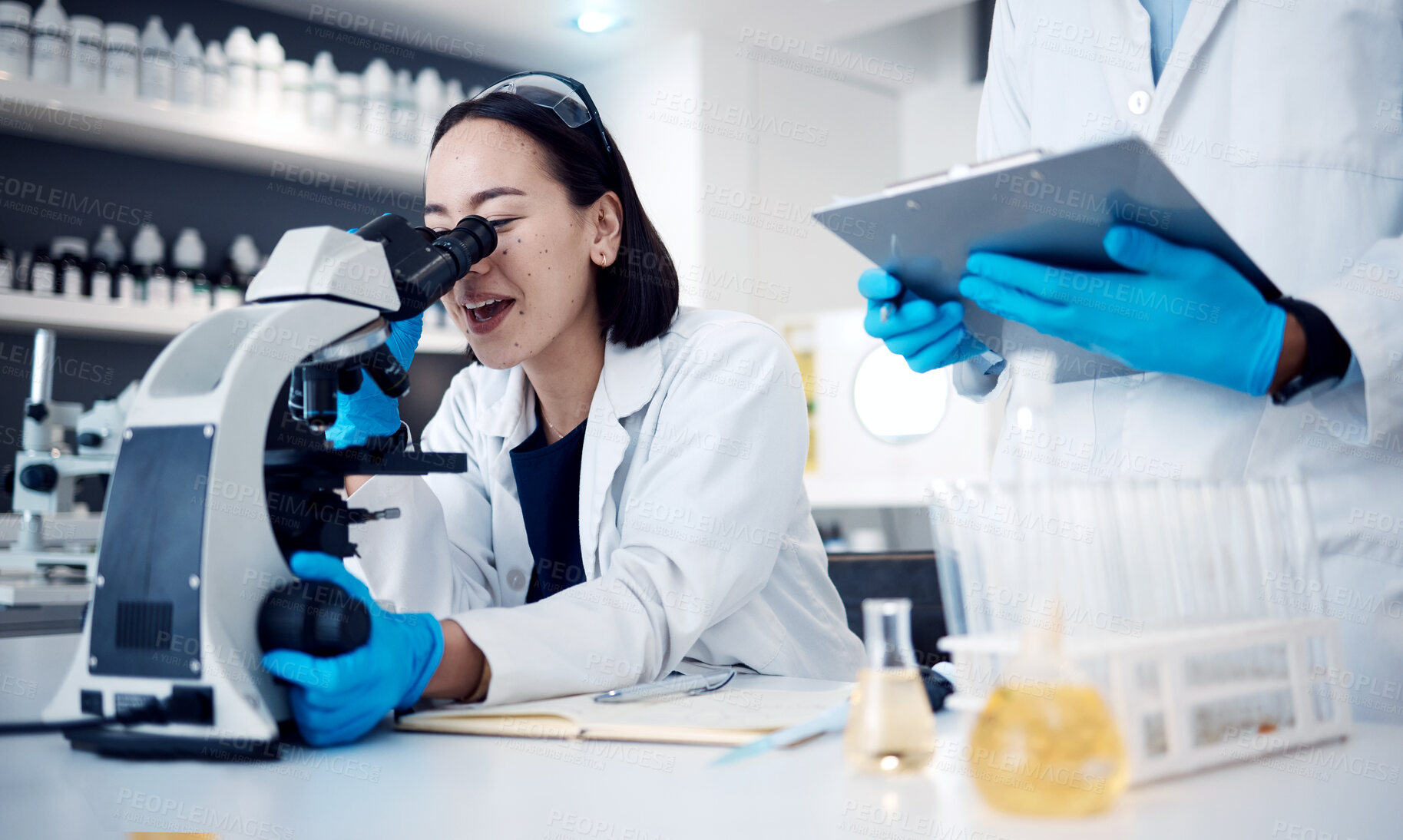 Buy stock photo Microscope, scientist and woman with worker, research and medical cure in laboratory. Clipboard, researchers and employees analyzing results, innovation or check sample data for collaboration or talk