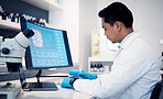 Man, scientist and computer with virus, bacteria and research data in laboratory. Science worker writing notes on vaccine, development or dna on technology, digital analytics or pharmaceutical health