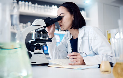 Buy stock photo Science, microscope and writing with a doctor woman doing research in her laboratory for innovation. Healthcare, zoom and notebook with a female scientist working in a lab for medical development