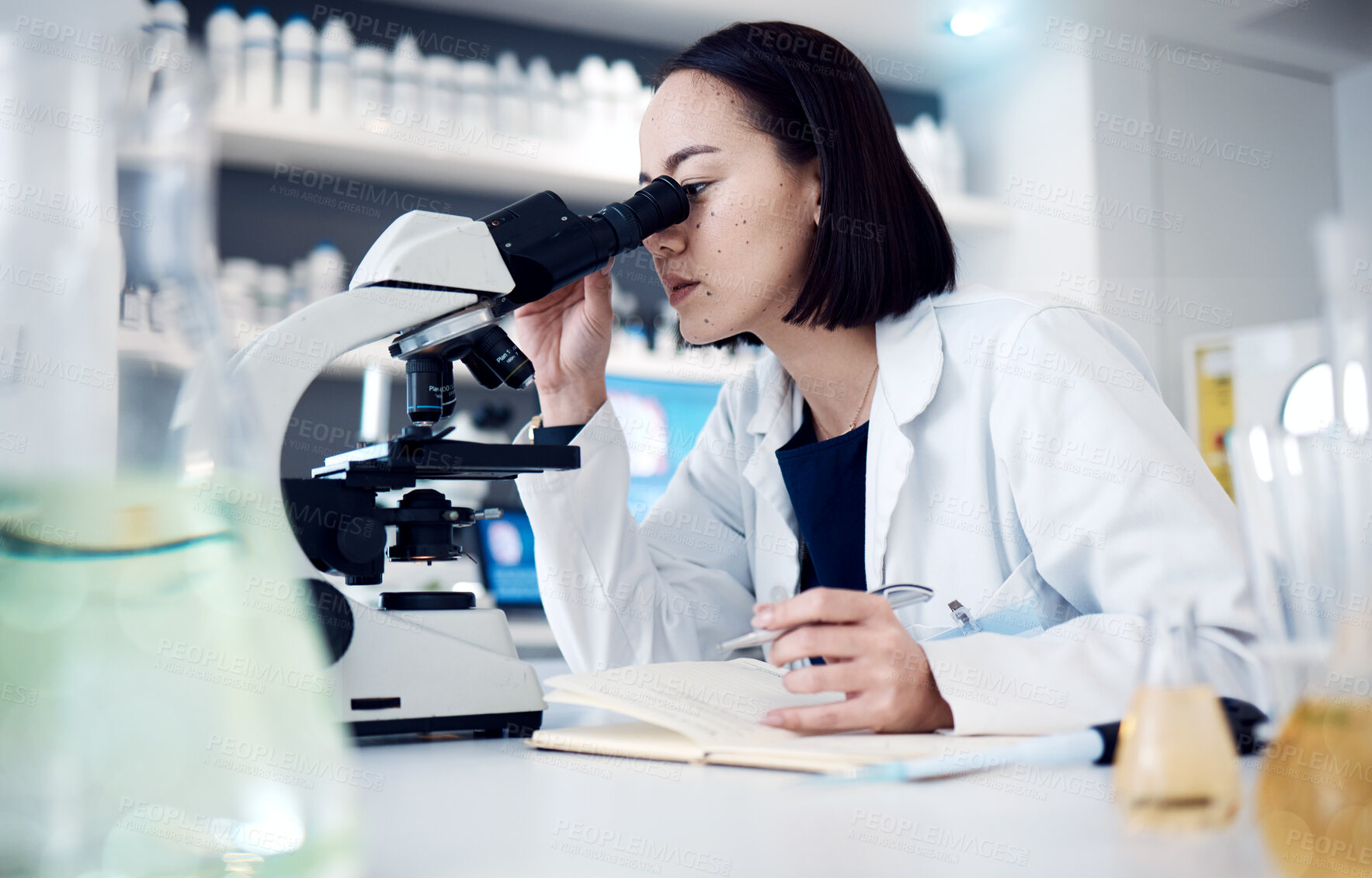 Buy stock photo Science, microscope and writing with a doctor woman doing research in her laboratory for innovation. Healthcare, zoom and notebook with a female scientist working in a lab for medical development