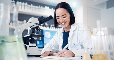 Buy stock photo Science, notes and woman in laboratory for data analysis, research and test results with microscope technology innovation. Writing, notebook and asian pharmaceutical pharmacist or scientist in clinic