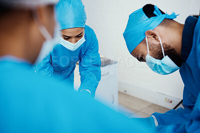 Buy stock photo Covid, healthcare and surgery doctors in hospital for professional operation of patient. Focus, surgeons and medical people in theater with surgical face mask for protection and hygiene.