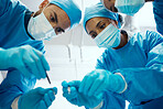 Surgery, teamwork or doctors in a medical emergency operation theater with collaboration or team work helping a patient. Support, life insurance or focused healthcare workers in face masks working 
