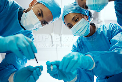Buy stock photo Surgery, teamwork or doctors in a medical emergency operation theater with collaboration or team work helping a patient. Support, life insurance or focused healthcare workers in face masks working 