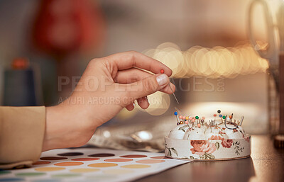 Buy stock photo Fashion design, woman hand and pin cushion in a workshop for fashion, sewing and tailor work of designer for manufacturing and production process. Needle, craft and sew with dressmaker or seamstress