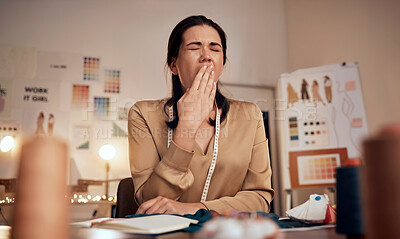 Buy stock photo Tired fashion designer, woman and yawn while working at night in creative office, textile studio or startup. Exhausted, sleepy and overworked tailor yawning in burnout, stress and fatigue in workshop