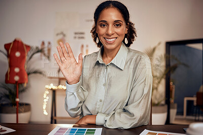 Buy stock photo Wave, fashion and pallet with a black woman designer on a video call in her studio office at night. Portrait, waving and hand gesture with an employee at work for digital meeting in a design workshop