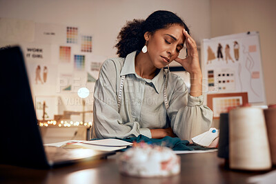 Buy stock photo Stress, headache and fashion, woman designer in studio with laptop, burnout and financial anxiety. Finance, debt and overworked tired black woman working late on clothing design deadline in office.
