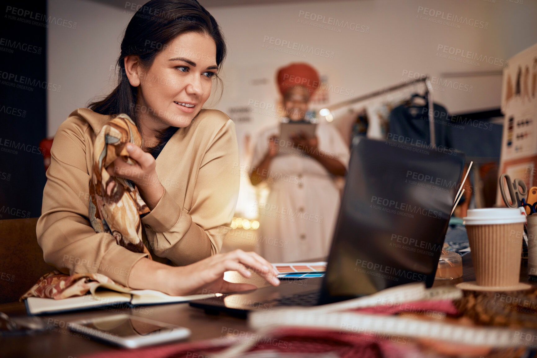 Buy stock photo Woman, fashion designer and laptop planning, fabric ideas and internet technology in textile studio. Happy tailor, computer or manufacturing with team in startup, small business or creative workshop 