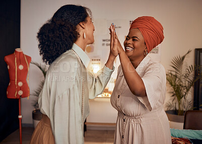 Buy stock photo Fashion, designer team and high five for style or clothing design success in a design studio. Black women, creative fashionable teamwork and hands together to celebrate successful brainstorming