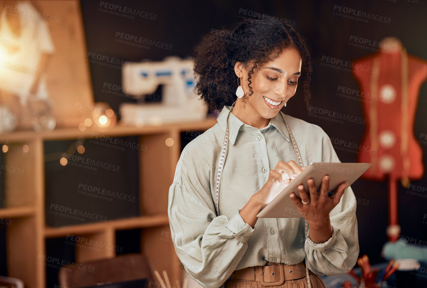 Buy stock photo Black woman, fashion designer and tablet for planning, internet and web ideas in textile studio. Happy tailor, digital technology and manufacturing startup, small business owner and creative workshop