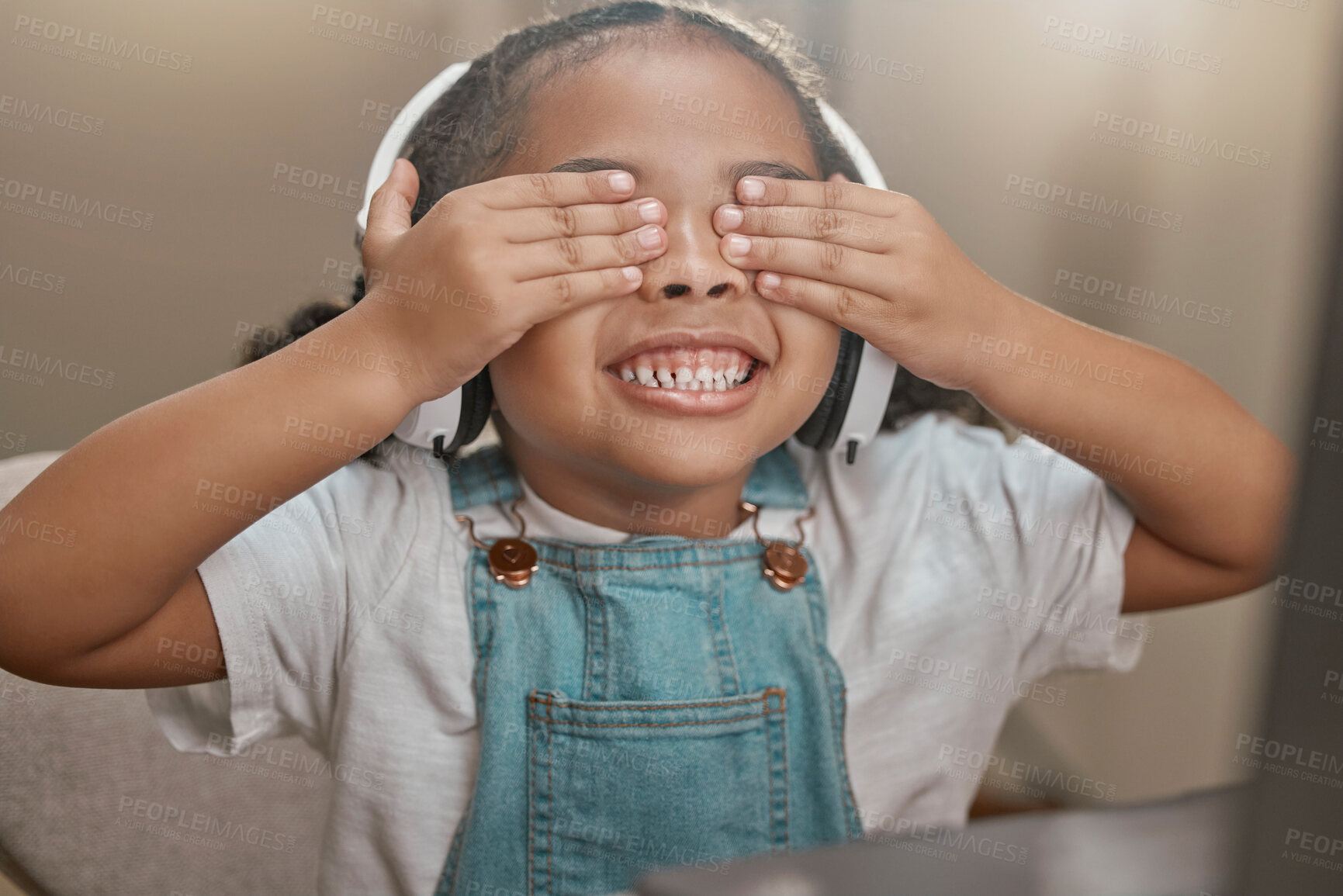 Buy stock photo Girl, video call and child play peekaboo in home, smiling and having fun. Face, headphones and kid in webinar, online conference or video chat in house playing hide and seek enjoying time on laptop.