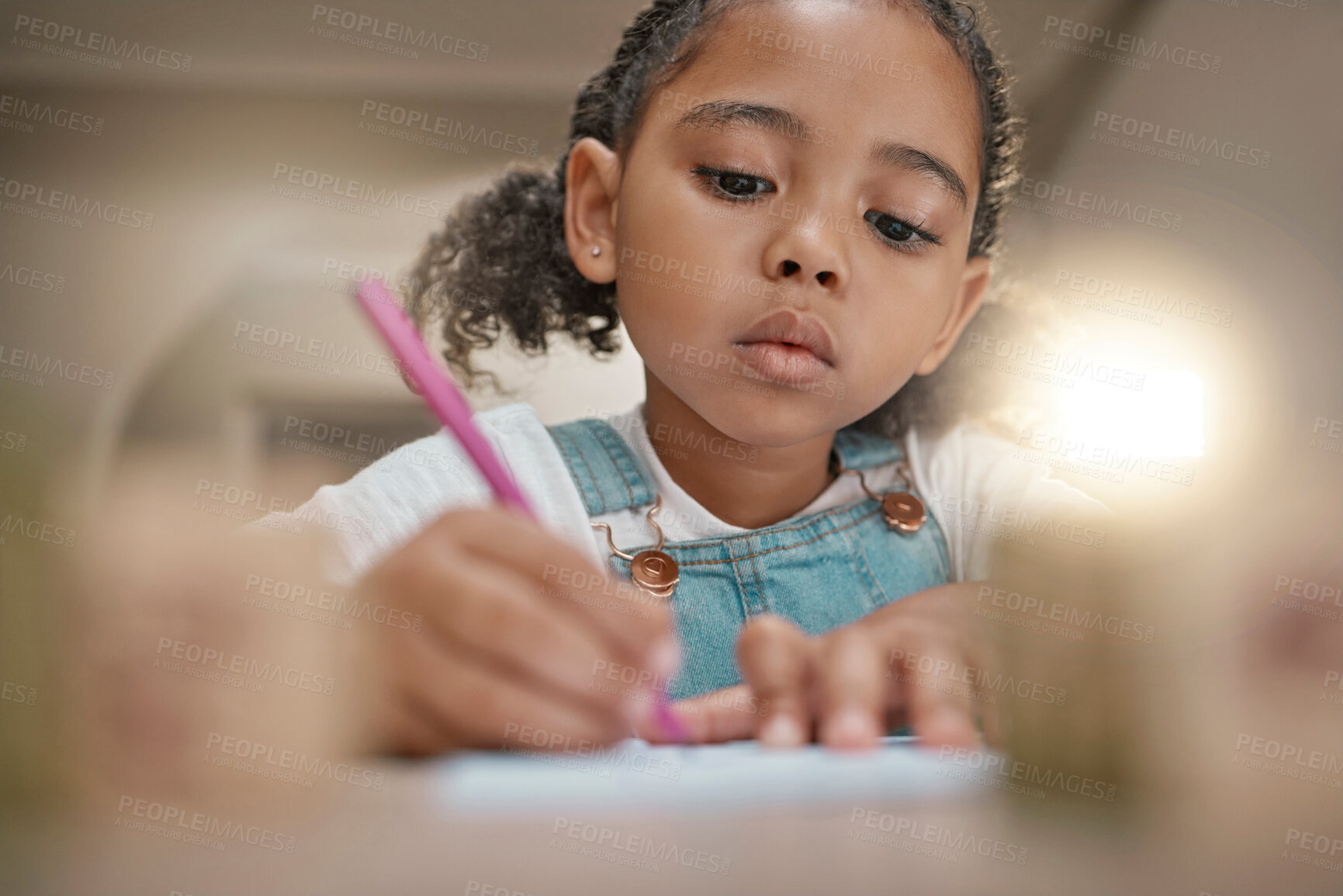 Buy stock photo Student, child learning and writing in notebook for development, fine motor skills and home schooling. Education, knowledge study and kid creative drawing or write on paper with pencil on home desk