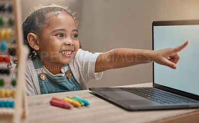 Buy stock photo Education, home school and elearning with a student girl pointing at a laptop while studying for development. Computer, math and internet with a female child pupil remote learning alone in her house