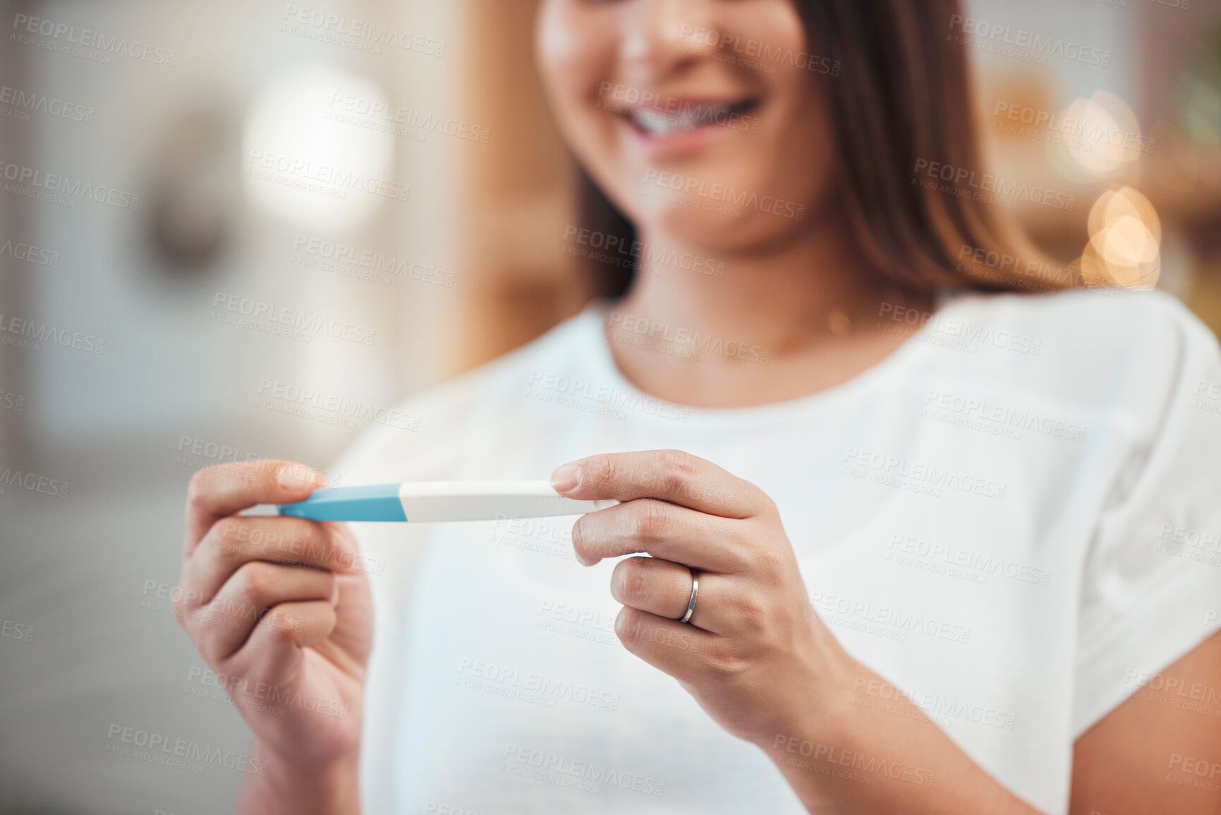 Buy stock photo Woman, hand and pregnancy test result with a happy mother to be ready for her baby at home. Mom, pregnant stick test and excited female ready for children or babies feeling happiness about family