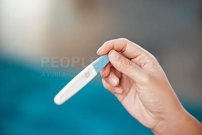 Buy stock photo Hands, pregnancy test and news with positive results for pregnant, lines or information at home on mockup. Hand holding maternity testing stick for confirmation, mother to be or pregnancy sign