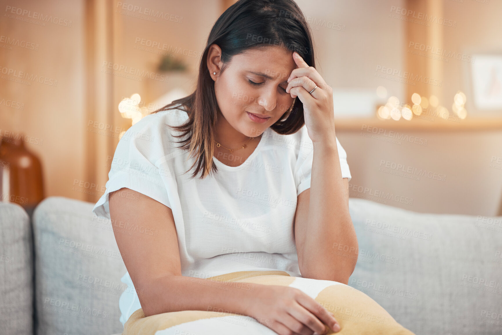 Buy stock photo Woman, stress and headache in pain on sofa from depression, anxiety or mental health issues at home. Sad female holding head suffering from mental illness, discomfort or loss on living room couch