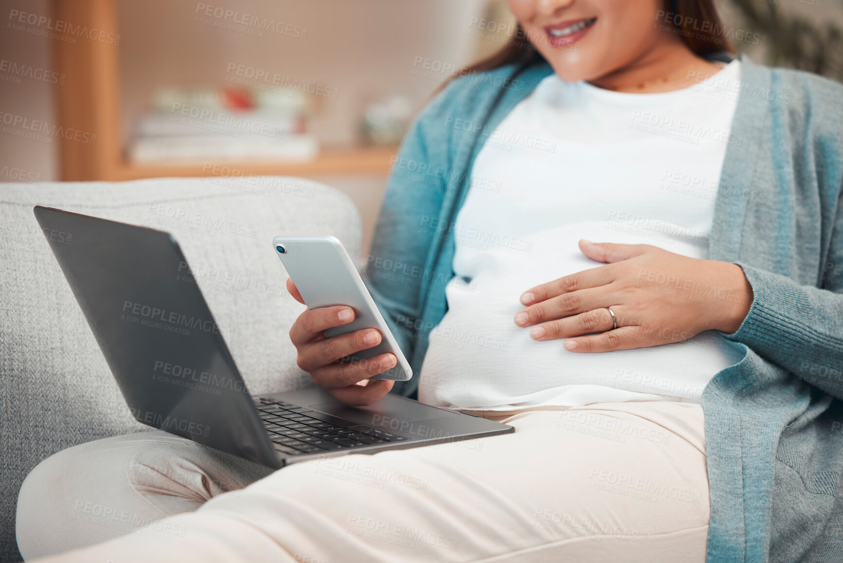 Buy stock photo Relax, pregnancy and woman on sofa with phone and laptop in living room at home reading email or text. Internet, video call or social media, pregnant woman sitting on couch with smile surfing online.