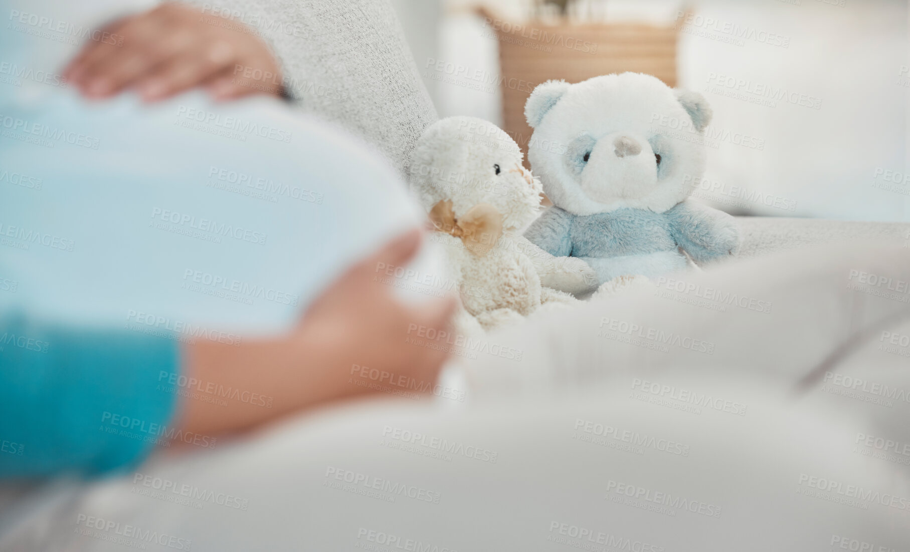 Buy stock photo Mother, stomach and teddy bear in the background while relaxing on the sofa at home. Pregnancy, maternity and female rest in her house with toys while preparing for parenthood and motherhood