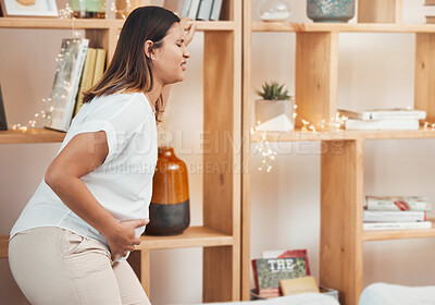 Buy stock photo Woman in labor, birth and pregnant with pain and water break at family home, pregnancy and new mom. Childbirth, stomach pain and pregnant woman health, prenatal care and maternity with new mama.