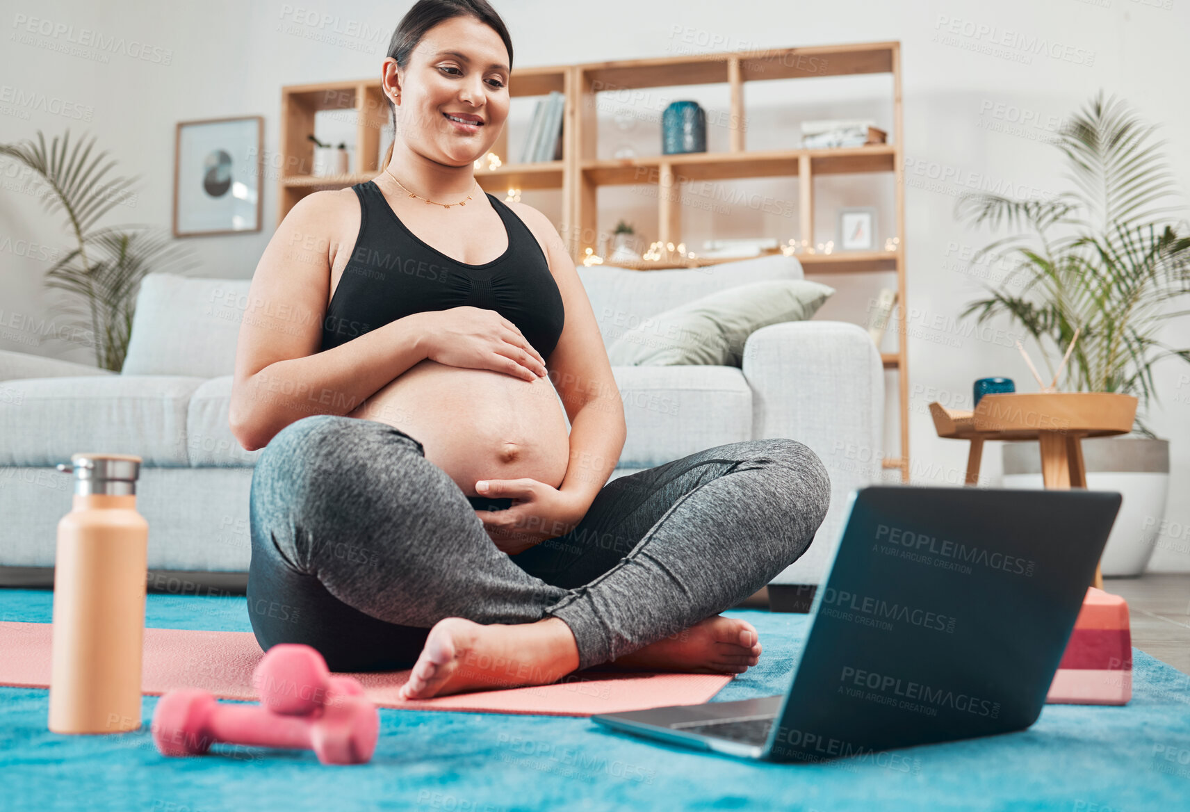 Buy stock photo Laptop, pregnancy yoga and woman in a living room doing wellness exercise tutorial at home. Fitness, meditation and pregnant lady streaming pilates health workout on internet with computer in lounge.