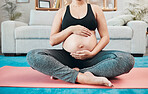 Woman, pregnant and holding stomach, yoga and pilates exercise on the floor, living room and home. Mother, pregnancy or fitness training, wellness workout or calm meditation for healthy body in house