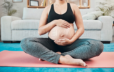 Buy stock photo Woman, pregnant and holding stomach, yoga and pilates exercise on the floor, living room and home. Mother, pregnancy or fitness training, wellness workout or calm meditation for healthy body in house