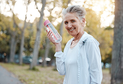 Buy stock photo Water, fitness and park with a senior woman holding a bottle during an exercise or workout for a healthy lifestyle. Portrait, training and wellness with a mature female exercising outdoor in a garden