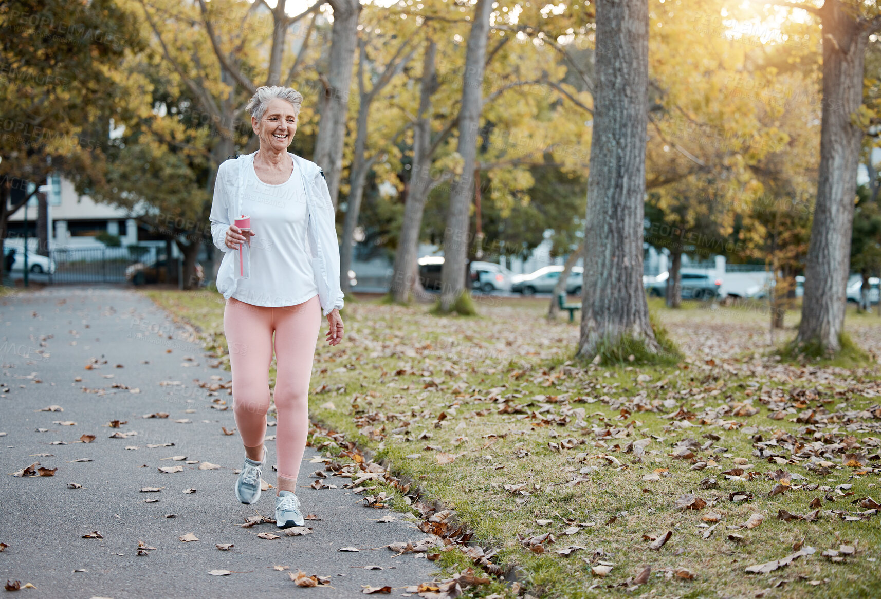 Buy stock photo Health, nature and senior woman on walk in the morning for exercise, wellness and fitness in park. Healthy, outdoor and elderly lady in retirement from Australia walking in garden for cardio workout.