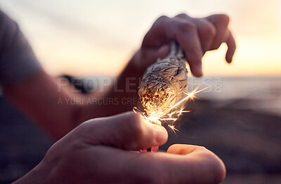 Buy stock photo Hand, flame and sage burning at the beach for a spiritual ritual and meditation practice. Herb, finger and lighter with a plant being burned for zen meditative, mental health and chakra ceremony