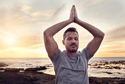 Buy stock photo Sunrise yoga, peace and man at the beach for mind wellness, spiritual freedom and relax exercise by the ocean in Bali. Zen meditation, soul training and person at the sea for calm in the morning