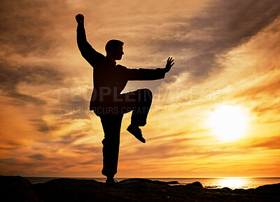 Buy stock photo Sunset, beach and silhouette of man doing yoga for mind, body and spiritual wellness in the evening. Twilight, pilates and shadow of guy doing meditation exercise for health in nature by ocean water.